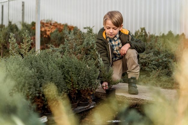 front-view-little-boy-tree-nursery_23-2148814055-8312829