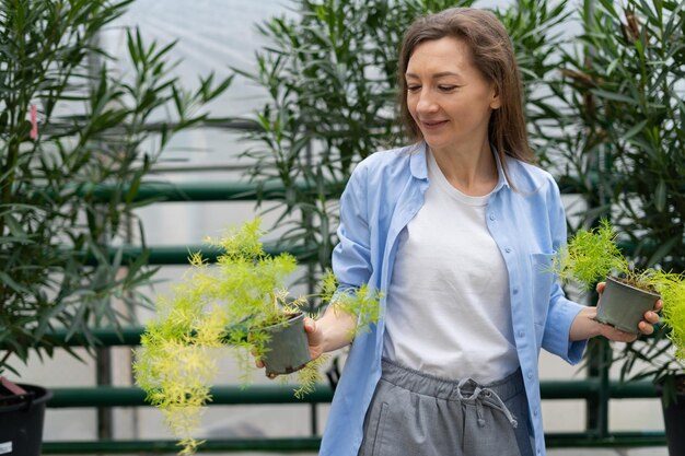 pretty-young-woman-buys-houseplants-garden-center-woman-chooses-asparagus-her-home-plant-nursery-planting-season_275234-5444-9134830