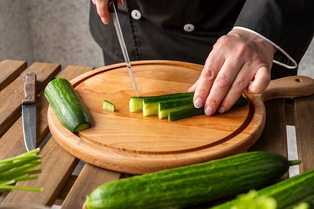 chef-cutting-cucumbers_23-2148491226-4419102