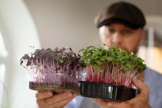 man-cultivating-farming-edible-plants-indoors_23-2149854815-4155912