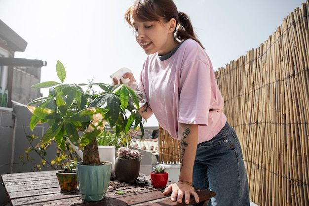 medium-shot-smiley-woman-with-plants_23-2149413493-9176738