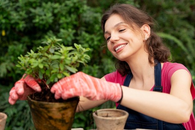 young-woman-taking-care-her-plants-greenhouse_23-2149037271-7531125